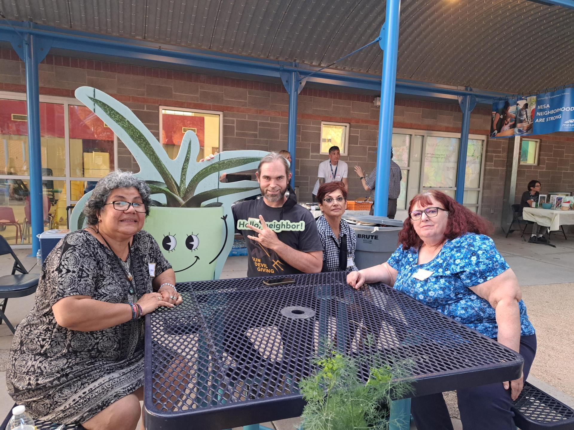 Residents posing with the event mascot